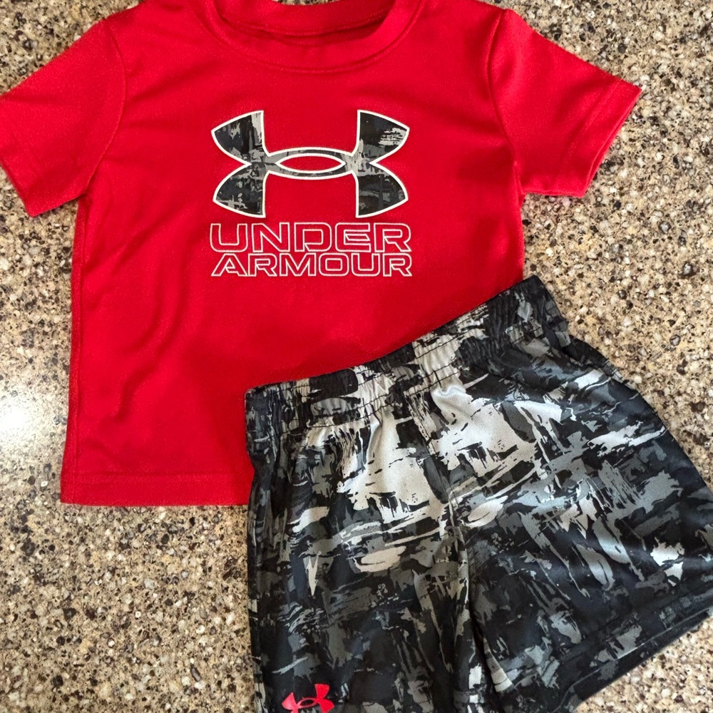 Under Armour Red T Shirt with Black Camo Like Logo. 18 Months